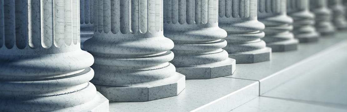 The base of several large marble columns.